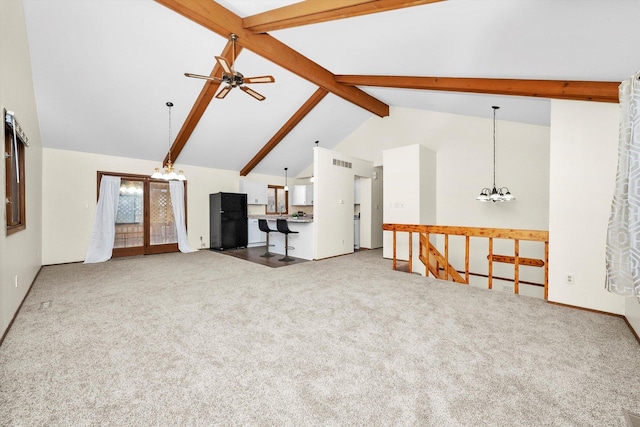 carpeted living room with beamed ceiling, ceiling fan with notable chandelier, and high vaulted ceiling