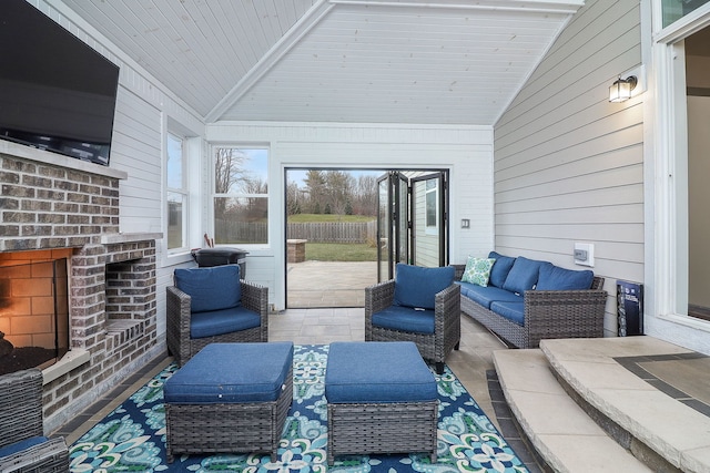 view of patio featuring an outdoor living space with a fireplace