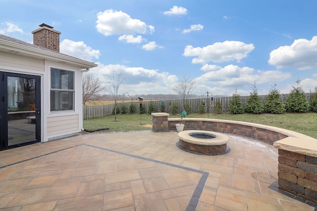 view of patio with a fire pit