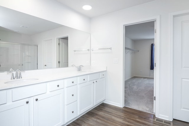 bathroom featuring vanity and wood-type flooring