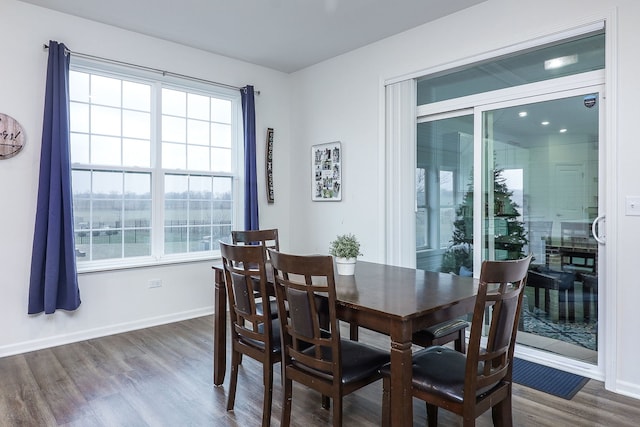 dining space featuring dark hardwood / wood-style floors