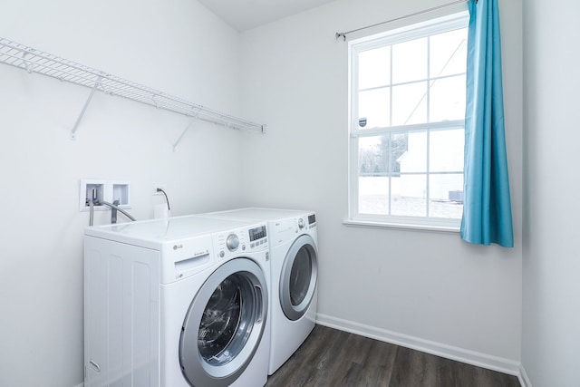 laundry area with a healthy amount of sunlight, dark wood-type flooring, and independent washer and dryer