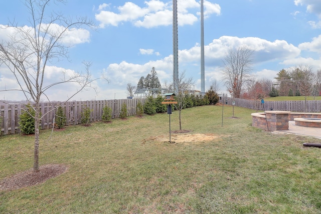 view of yard with an outdoor fire pit