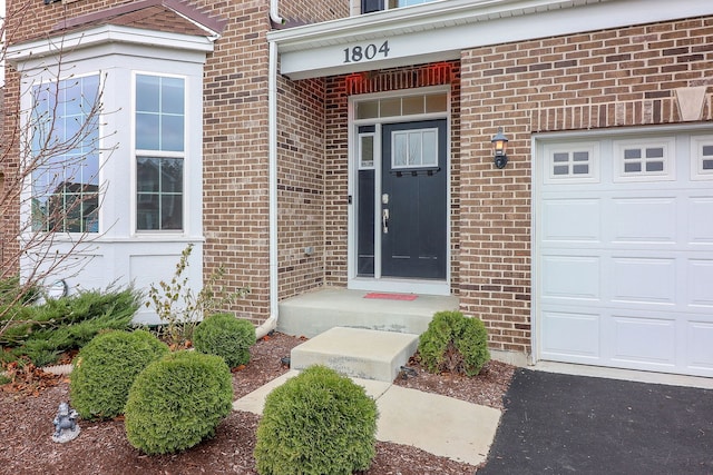 doorway to property featuring a garage