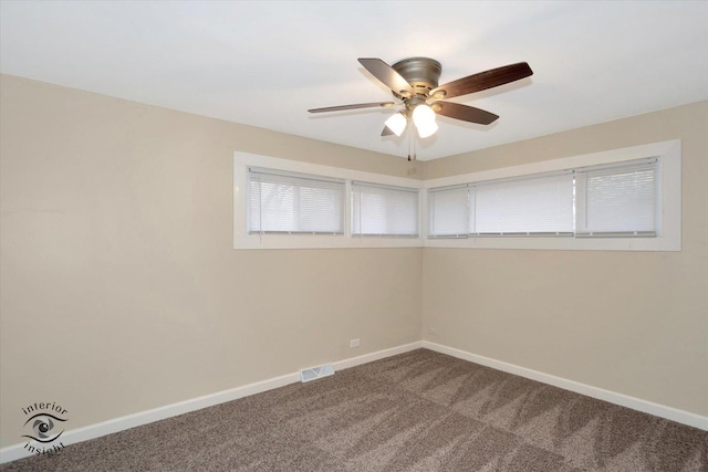 unfurnished room with ceiling fan and carpet