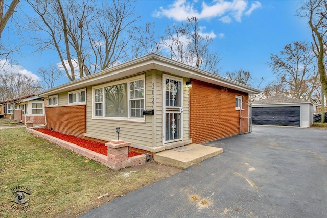 view of property exterior featuring a garage and an outdoor structure