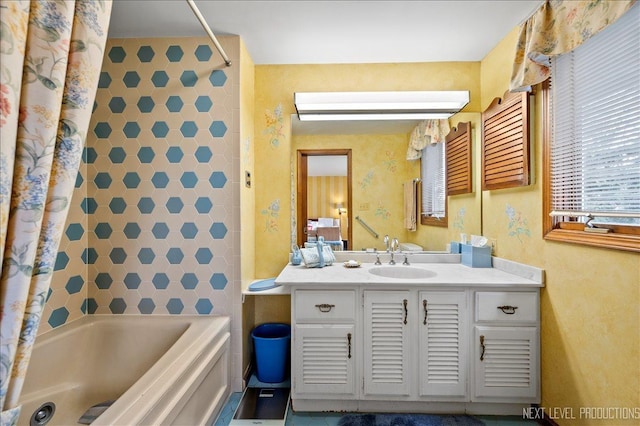 bathroom with vanity, tile walls, and shower / tub combo with curtain