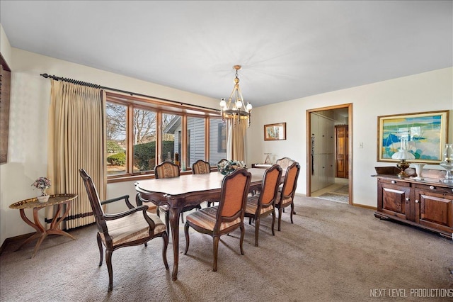 dining space featuring light colored carpet and a notable chandelier