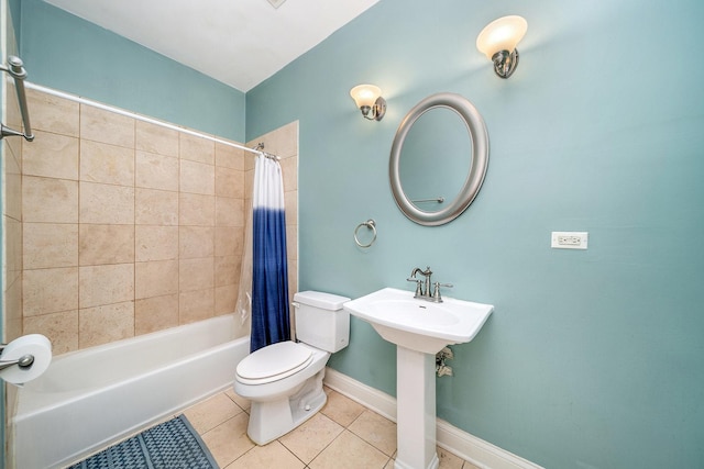 bathroom with tile patterned flooring, shower / tub combo, and toilet