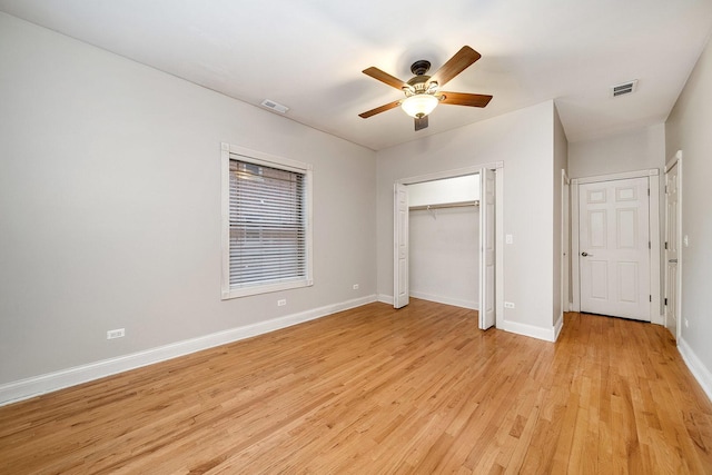 unfurnished bedroom with ceiling fan and light wood-type flooring