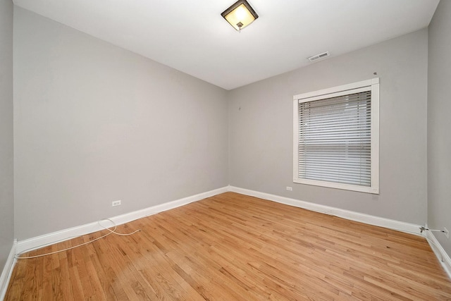 unfurnished room featuring light hardwood / wood-style floors