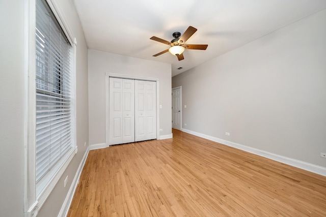 unfurnished bedroom with a closet, ceiling fan, and light hardwood / wood-style floors