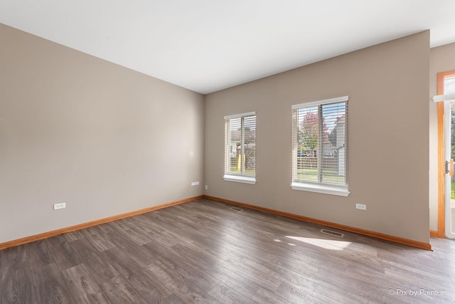 empty room featuring hardwood / wood-style floors