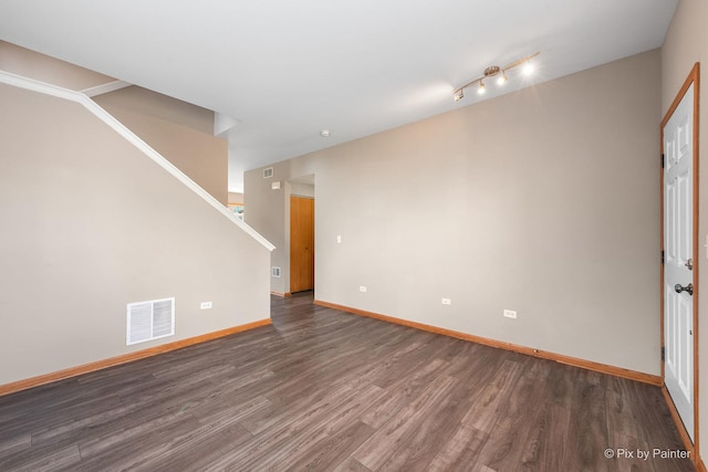 empty room featuring dark hardwood / wood-style floors