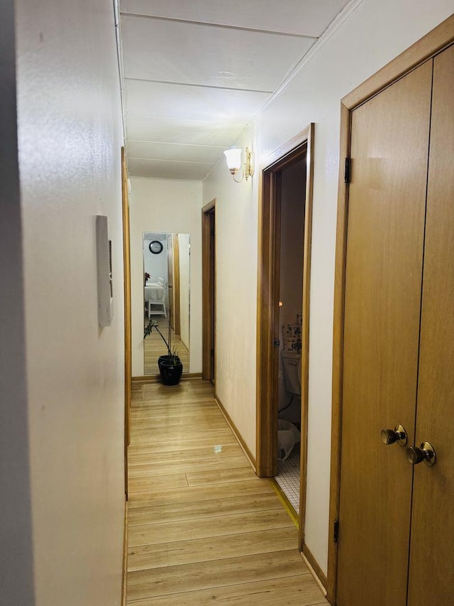 hall with light hardwood / wood-style floors