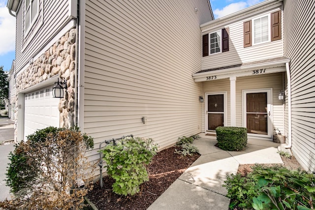 entrance to property featuring a garage