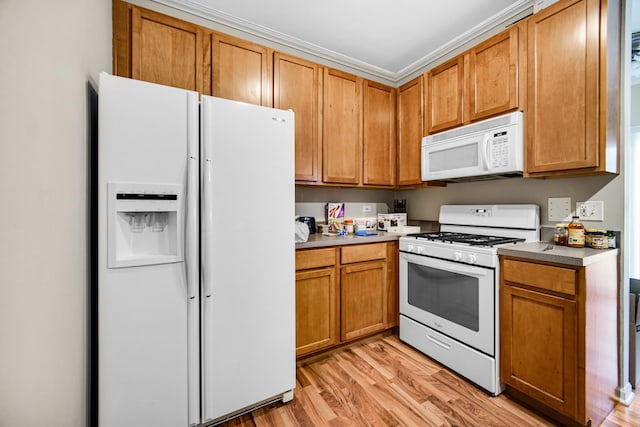 kitchen featuring light hardwood / wood-style flooring, white appliances, and ornamental molding