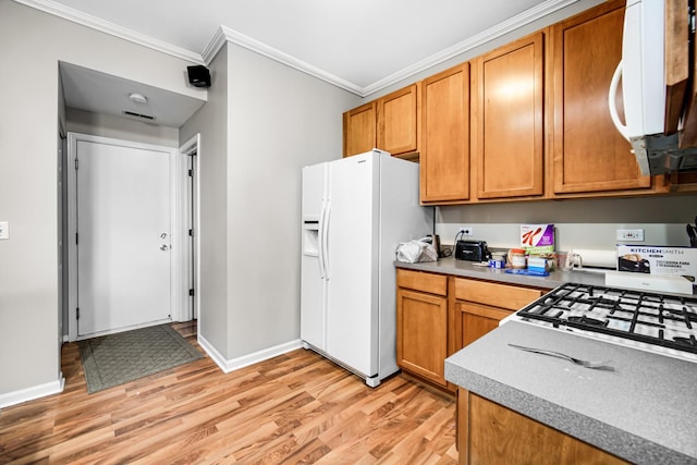 kitchen featuring crown molding, white appliances, and light wood-type flooring