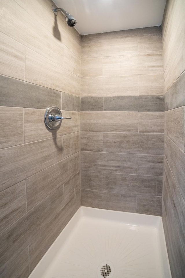 bathroom with tiled shower