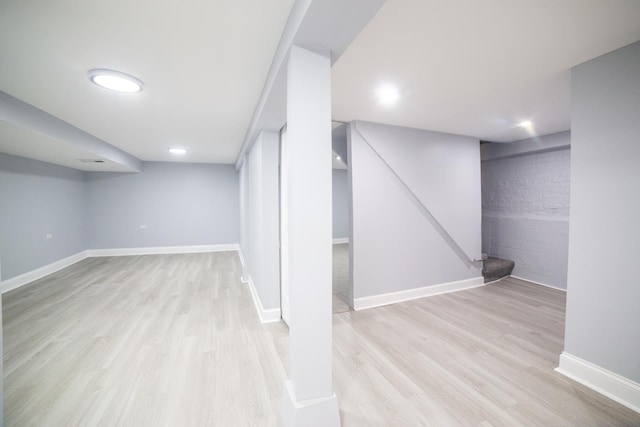 basement featuring light hardwood / wood-style flooring