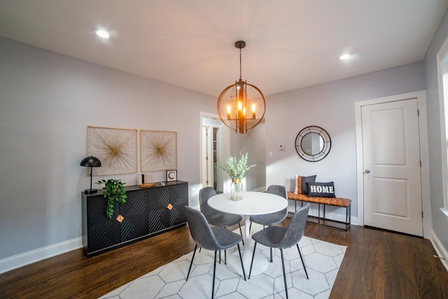 dining space featuring a chandelier and dark hardwood / wood-style floors