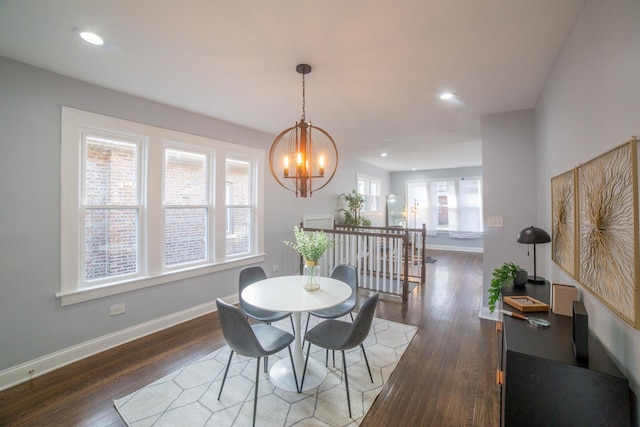 dining room featuring a chandelier and dark hardwood / wood-style floors