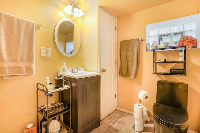 bathroom with tile patterned flooring, vanity, and an inviting chandelier