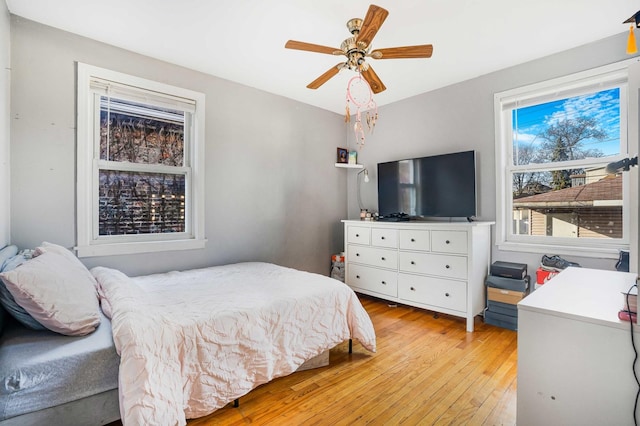 bedroom featuring light hardwood / wood-style floors and ceiling fan