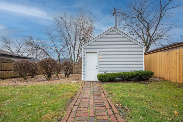 view of outdoor structure featuring a lawn