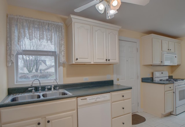 kitchen with white cabinetry, sink, ceiling fan, and white appliances