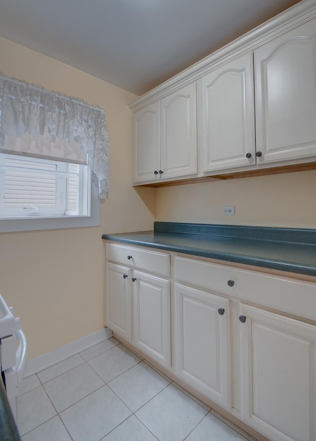 laundry room featuring light tile patterned flooring