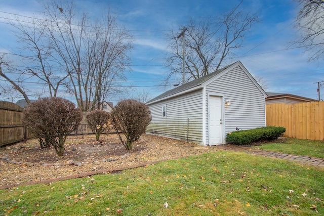 view of outbuilding with a yard