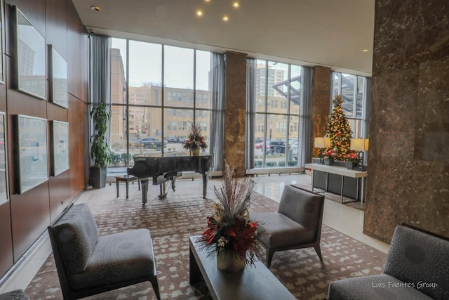 community lobby featuring expansive windows and recessed lighting