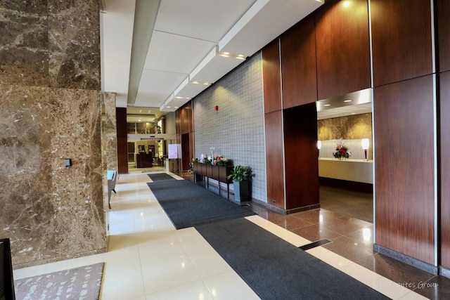 lobby featuring tile walls