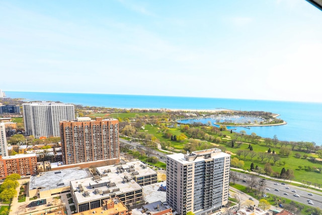 view of urban area with a large body of water and apartment complex / building