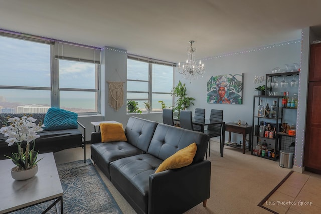 carpeted living room with a chandelier