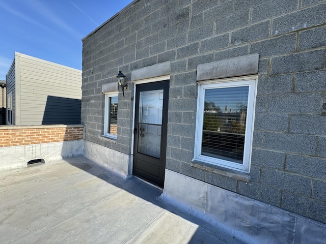 doorway to property featuring a patio