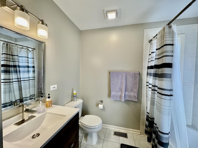 bathroom with tile patterned floors, vanity, and toilet