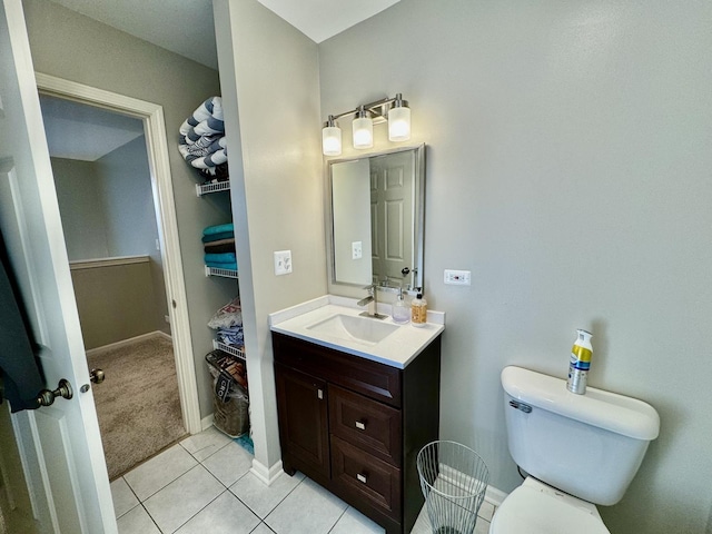 bathroom with tile patterned floors, vanity, and toilet