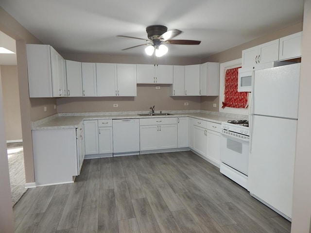 kitchen with ceiling fan, white cabinetry, white appliances, and light hardwood / wood-style flooring