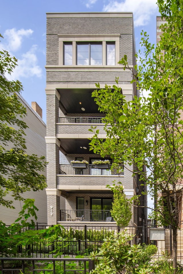 view of front of house with a balcony