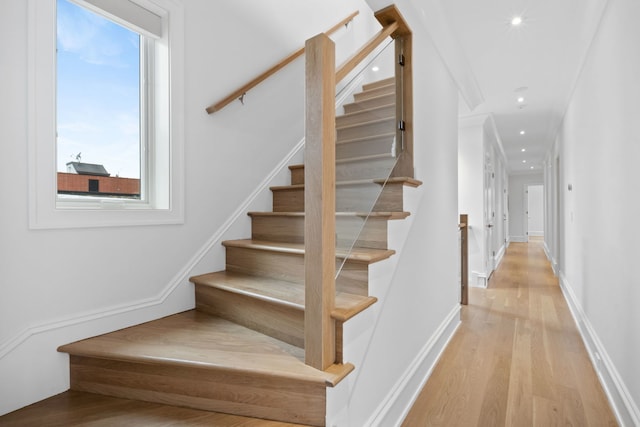 stairs with wood-type flooring