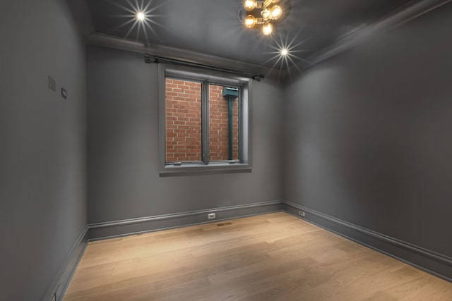 empty room with light hardwood / wood-style floors