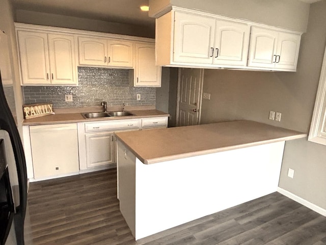 kitchen featuring dishwasher, dark wood-type flooring, sink, decorative backsplash, and white cabinetry