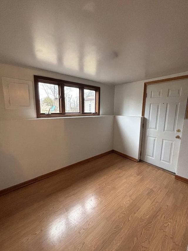 unfurnished room featuring light wood-type flooring