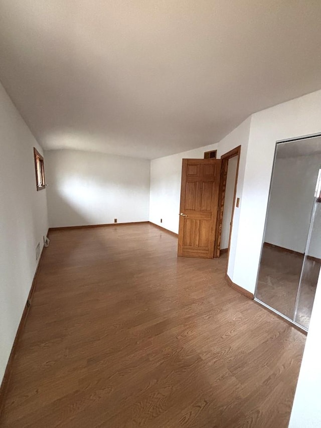 interior space featuring a closet and hardwood / wood-style flooring