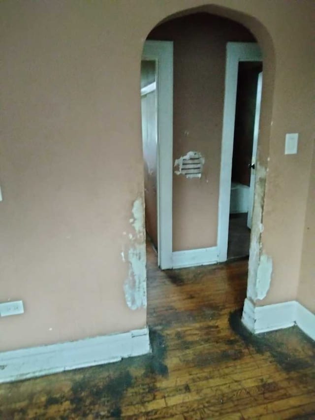 corridor with dark wood-type flooring