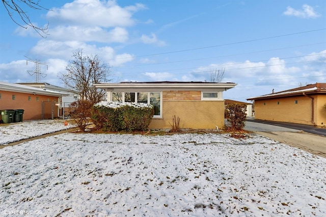 view of snow covered house