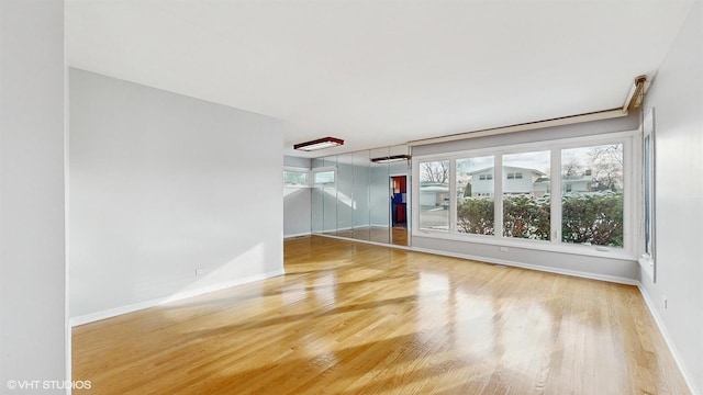 unfurnished living room featuring hardwood / wood-style floors