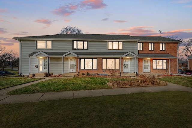 view of front of home with a lawn